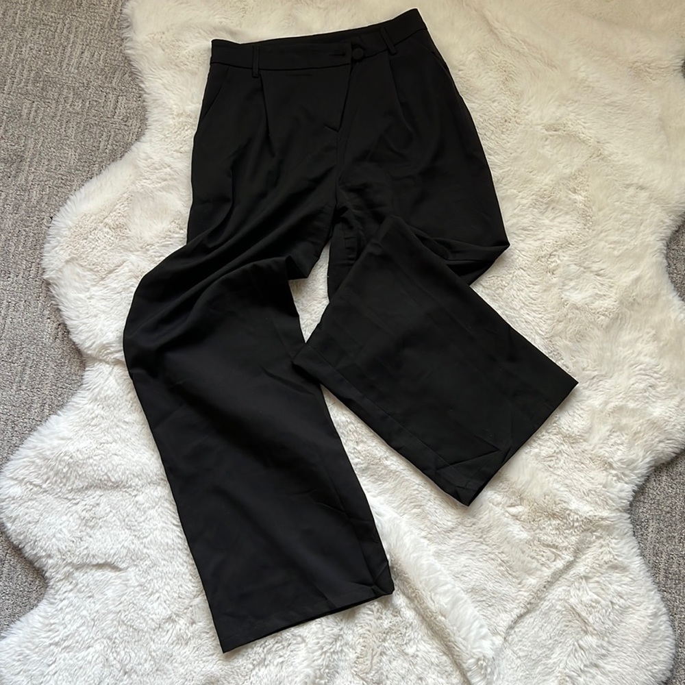 Black asymmetrical wide leg slacks
